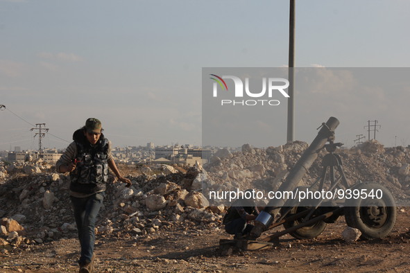 Locally made shells are launched by Free Syrian Army fighters towards the Sheikh Maqsud neighbourhood of the northern Syrian city of Aleppo...