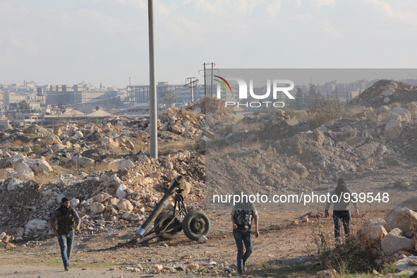 Locally made shells are launched by Free Syrian Army fighters towards the Sheikh Maqsud neighbourhood of the northern Syrian city of Aleppo...