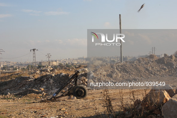 Locally made shells are launched by Free Syrian Army fighters towards the Sheikh Maqsud neighbourhood of the northern Syrian city of Aleppo...