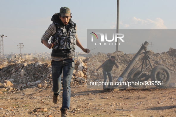 Locally made shells are launched by Free Syrian Army fighters towards the Sheikh Maqsud neighbourhood of the northern Syrian city of Aleppo...