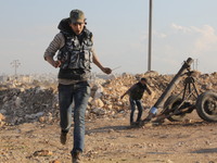 Locally made shells are launched by Free Syrian Army fighters towards the Sheikh Maqsud neighbourhood of the northern Syrian city of Aleppo...