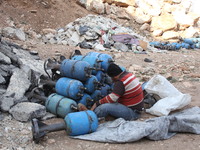 Free Syrian Army fighters prepare mortar shells towards the Sheikh Maqsud neighbourhood of the northern Syrian city of Aleppo on December 2,...