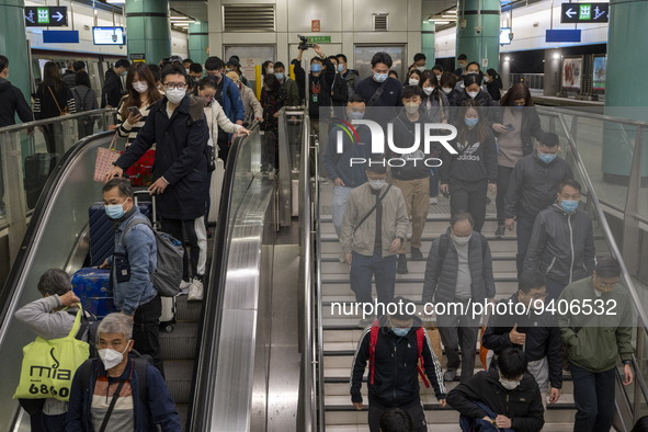 Travelers wearing face masks arriving at Lok Ma Chau Station on January 8, 2023 in Hong Kong, China. Hong Kong today resumes quarantine free...