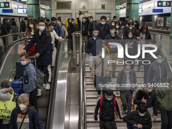 Travelers wearing face masks arriving at Lok Ma Chau Station on January 8, 2023 in Hong Kong, China. Hong Kong today resumes quarantine free...