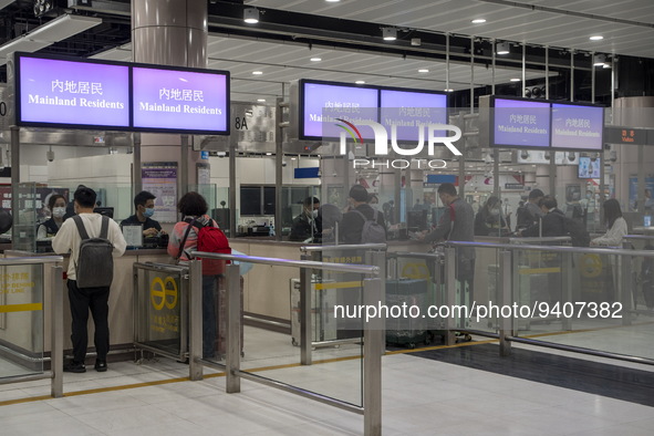 Mainland Residents lining up at an Immigration checkpoint at Lok Ma Chau Control Point on January 8, 2023 in Hong Kong, China. Hong Kong tod...