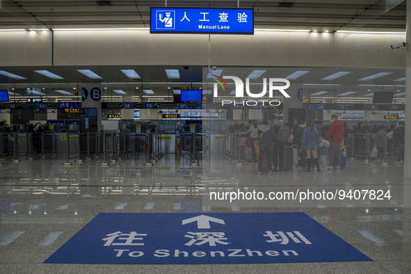 A sign on the ground pointing to Shenzhen at the immigration checkpoint in Futian Port on January 8, 2023 in Shenzhen, China. Hong Kong toda...