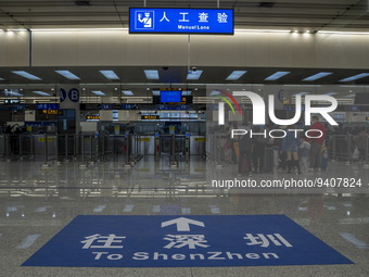 A sign on the ground pointing to Shenzhen at the immigration checkpoint in Futian Port on January 8, 2023 in Shenzhen, China. Hong Kong toda...