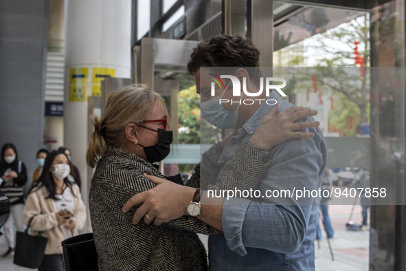 A man hugs his mother as they meet for the first time in 3 years outside Futian Port on January 8, 2023 in Shenzhen, China. Hong Kong today...