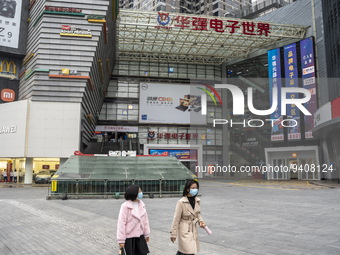 People wearing face masks walking in Huaqiangbei, a popular place to buy electronic goods on January 8, 2023 in Shenzhen, China. China today...