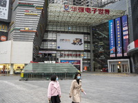 People wearing face masks walking in Huaqiangbei, a popular place to buy electronic goods on January 8, 2023 in Shenzhen, China. China today...