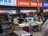 A shop Keeper at a shop inside a shopping center at Huaqiangbei, a popular place to buy electronic goods on January 8, 2023 in Shenzhen, Chi...