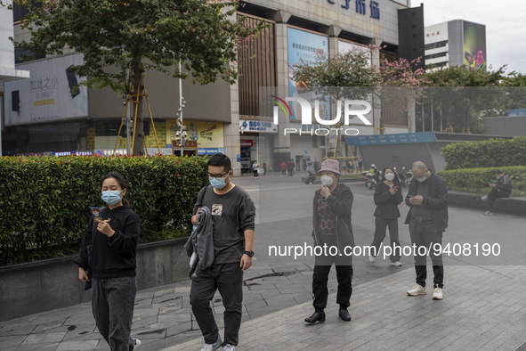 People wearing face masks walking in Huaqiangbei, a popular place to buy electronic goods on January 8, 2023 in Shenzhen, China. China today...