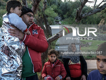 Migrants approach the coast of the northeastern Greek island of Lesbos on Thursday, Dec. 3, 2015. About 5,000 migrants are reaching Europe e...