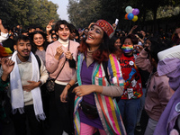 Participants and supporters of LGBTQ community dance during the annual Delhi Queer Pride March, an event promoting lesbian, gay, bisexual an...