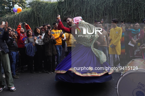 A participant dances as others cheer during the annual Delhi Queer Pride March, an event promoting lesbian, gay, bisexual and transgender ri...