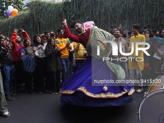 A participant dances as others cheer during the annual Delhi Queer Pride March, an event promoting lesbian, gay, bisexual and transgender ri...