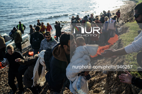 Migrants approach the coast of the northeastern Greek island of Lesbos on Thursday, Dec. 6, 2015. About 5,000 migrants are reaching Europe e...