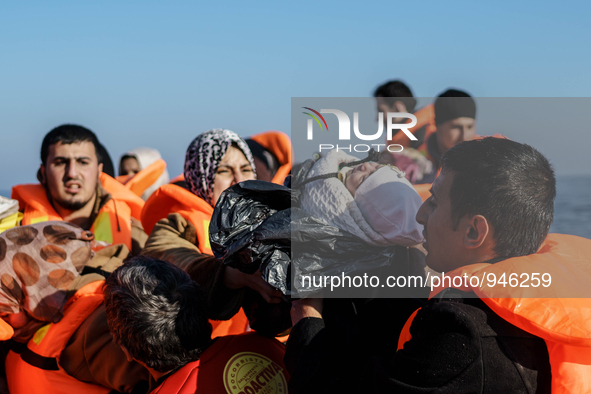 Migrants approach the coast of the northeastern Greek island of Lesbos on Thursday, Dec. 6, 2015. About 5,000 migrants are reaching Europe e...