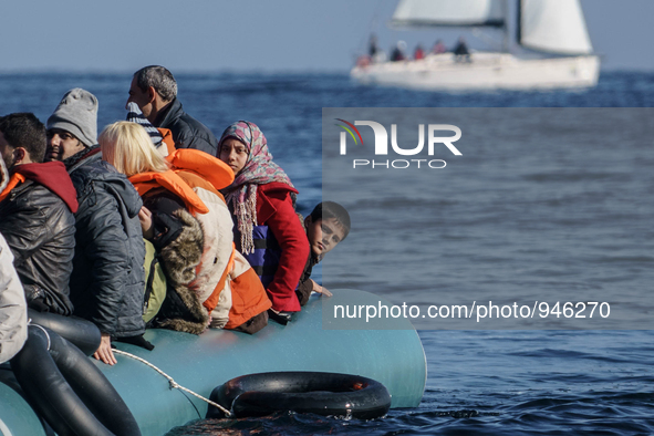 Migrants approach the coast of the northeastern Greek island of Lesbos on Thursday, Dec. 6, 2015. About 5,000 migrants are reaching Europe e...