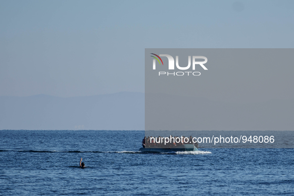 Migrants approach the coast of the northeastern Greek island of Lesbos on Thursday, Dec. 7, 2015. About 5,000 migrants are reaching Europe e...