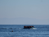 Migrants approach the coast of the northeastern Greek island of Lesbos on Thursday, Dec. 7, 2015. About 5,000 migrants are reaching Europe e...