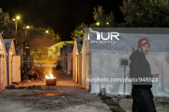 Refugees and migrants spend the night in a camp outside a processing center in Moria and Karatepe villages on the on the northeastern Greek...