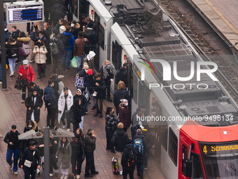 

A street train is arriving at the platform of Lanxess Arena as people get out of the train in Cologne, Germany on January 25, 2023, as the...