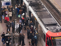 

A street train is arriving at the platform of Lanxess Arena as people get out of the train in Cologne, Germany on January 25, 2023, as the...