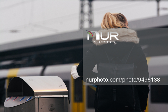 

A passenger is seen waiting at the train platform of the Deutz station in Cologne, Germany on January 25, 2023, as the state government of...