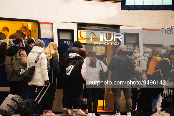 

Passengers are seen getting on the German regional train (Deutsch Bahn) at Cologne Central Station in Cologne, Germany on January 25, 2023...