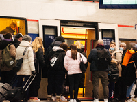 

Passengers are seen getting on the German regional train (Deutsch Bahn) at Cologne Central Station in Cologne, Germany on January 25, 2023...