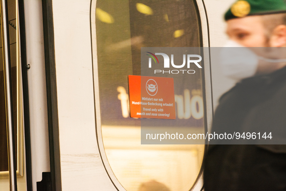 

A sign requiring masks is seen on a Deutsche Bahn ICE high-speed train at Cologne Central Station in Cologne, Germany on January 25, 2021,...