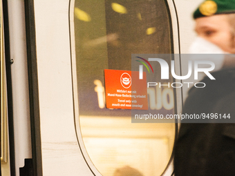 

A sign requiring masks is seen on a Deutsche Bahn ICE high-speed train at Cologne Central Station in Cologne, Germany on January 25, 2021,...