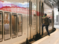 

A passenger is seen getting on a ICE high-speed train (Deutsche Bahn) at Cologne Central Station in Cologne, Germany, on January 25, 2023,...