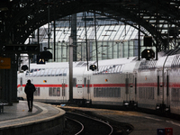 

A passenger is seen on the platform as an ICE high-speed train (Deutsche Bahn) parks at Cologne Central Station in Cologne, Germany on Jan...