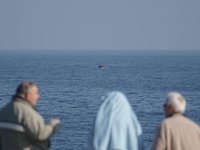 Refugees and migrants arrive on a dingy from the Turkish coast to the northeastern Greek island of Lesbos Dec. 8, 2015. (