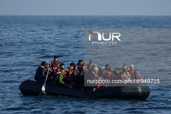 Refugees and migrants arrive on a dingy from the Turkish coast to the northeastern Greek island of Lesbos Dec. 8, 2015. 