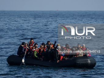 Refugees and migrants arrive on a dingy from the Turkish coast to the northeastern Greek island of Lesbos Dec. 8, 2015. (