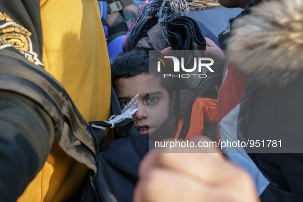 Migrants approach the coast of the Mytilene Greece island of Lesbos on Dec. 9, 2015. 