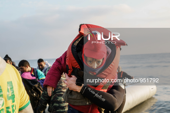 Migrants approach the coast of the Mytilene Greece island of Lesbos on Dec. 9, 2015. 