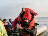 Migrants approach the coast of the Mytilene Greece island of Lesbos on Dec. 9, 2015. (