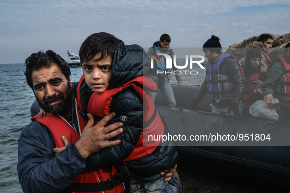 Migrants approach the coast of the Mytilene Greece island of Lesbos on Dec. 9, 2015. 