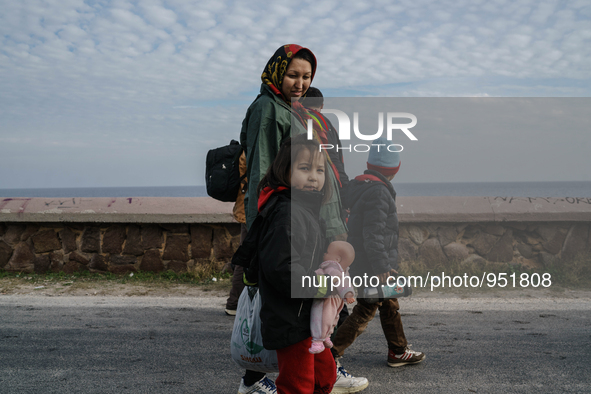 Migrants approach the coast of the Mytilene Greece island of Lesbos on Dec. 9, 2015. 