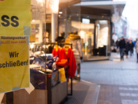 

A closing store sign is seen hanging on a retailer in the city center of Cologne, Germany on February 1, 2023, as the state government sta...