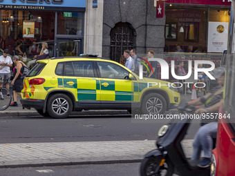 Yellow ambulance, an emergency service vehicle with paramedics of the National Health Service NHS parked on the streets of the British capit...