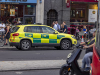 Yellow ambulance, an emergency service vehicle with paramedics of the National Health Service NHS parked on the streets of the British capit...