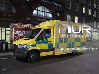 Yellow ambulance, an emergency service vehicle with paramedics of the National Health Service NHS parked on the streets of the British capit...