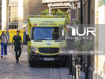 Yellow ambulance, an emergency service vehicle with paramedics of the National Health Service NHS parked on the streets of the British capit...