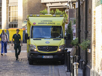 Yellow ambulance, an emergency service vehicle with paramedics of the National Health Service NHS parked on the streets of the British capit...