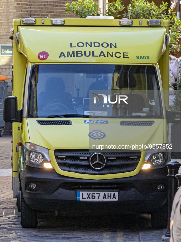 Yellow ambulance, an emergency service vehicle with paramedics of the National Health Service NHS parked on the streets of the British capit...